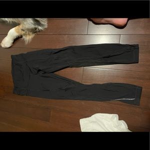 Lululemon leggings with mesh detail and pockets. No size tag